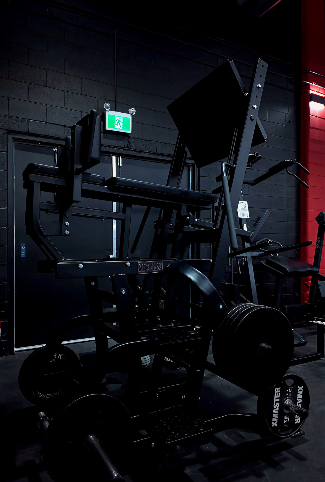 Black MEGAMASS Swing Squat Pro loaded with XMASTER plates at Legacy Athletix
